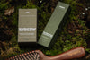 Woodland Ritual and Woodland Gaze boxes on moss with the Mimirra sandalwood scalp brush